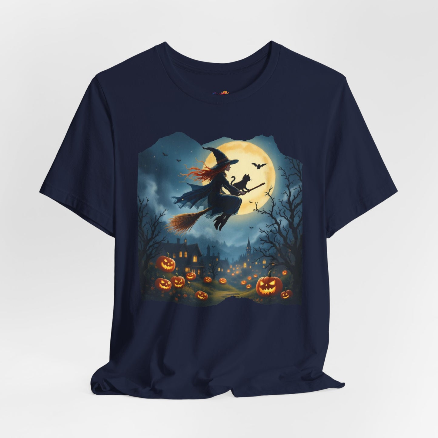 Midnight Flight Tee Magic in the sky. Pumpkins below. Cozy spells in every thread.