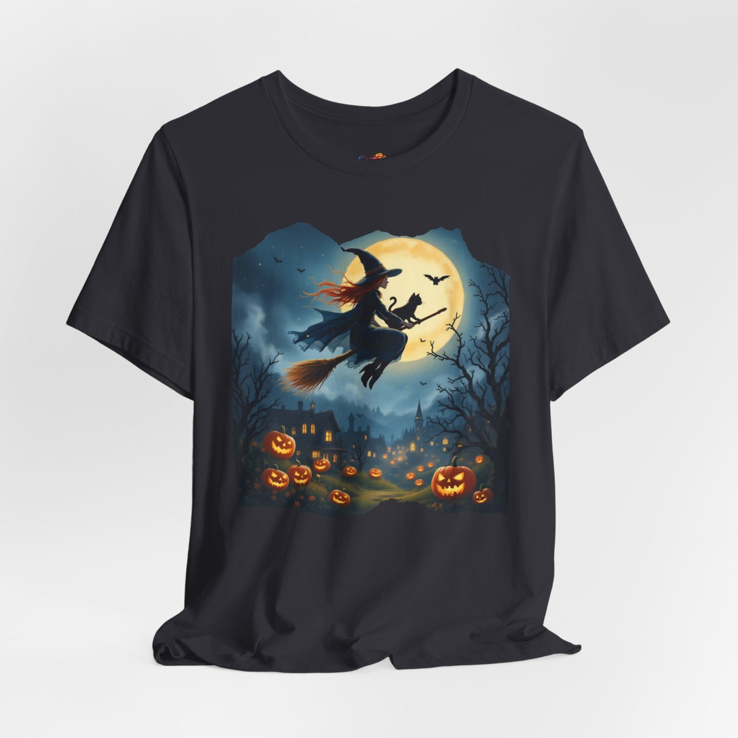 Midnight Flight Tee Magic in the sky. Pumpkins below. Cozy spells in every thread.
