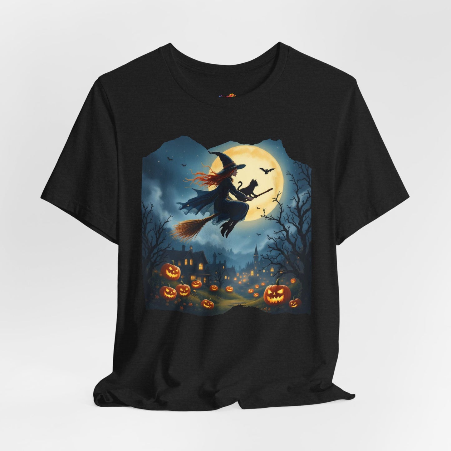 Midnight Flight Tee Magic in the sky. Pumpkins below. Cozy spells in every thread.