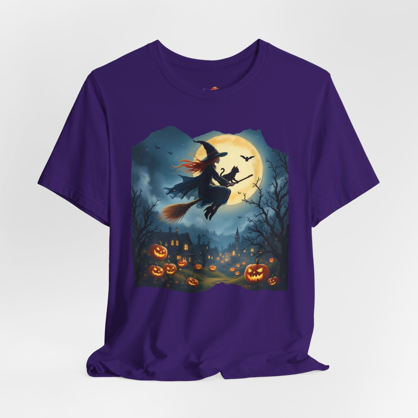 Midnight Flight Tee Magic in the sky. Pumpkins below. Cozy spells in every thread.