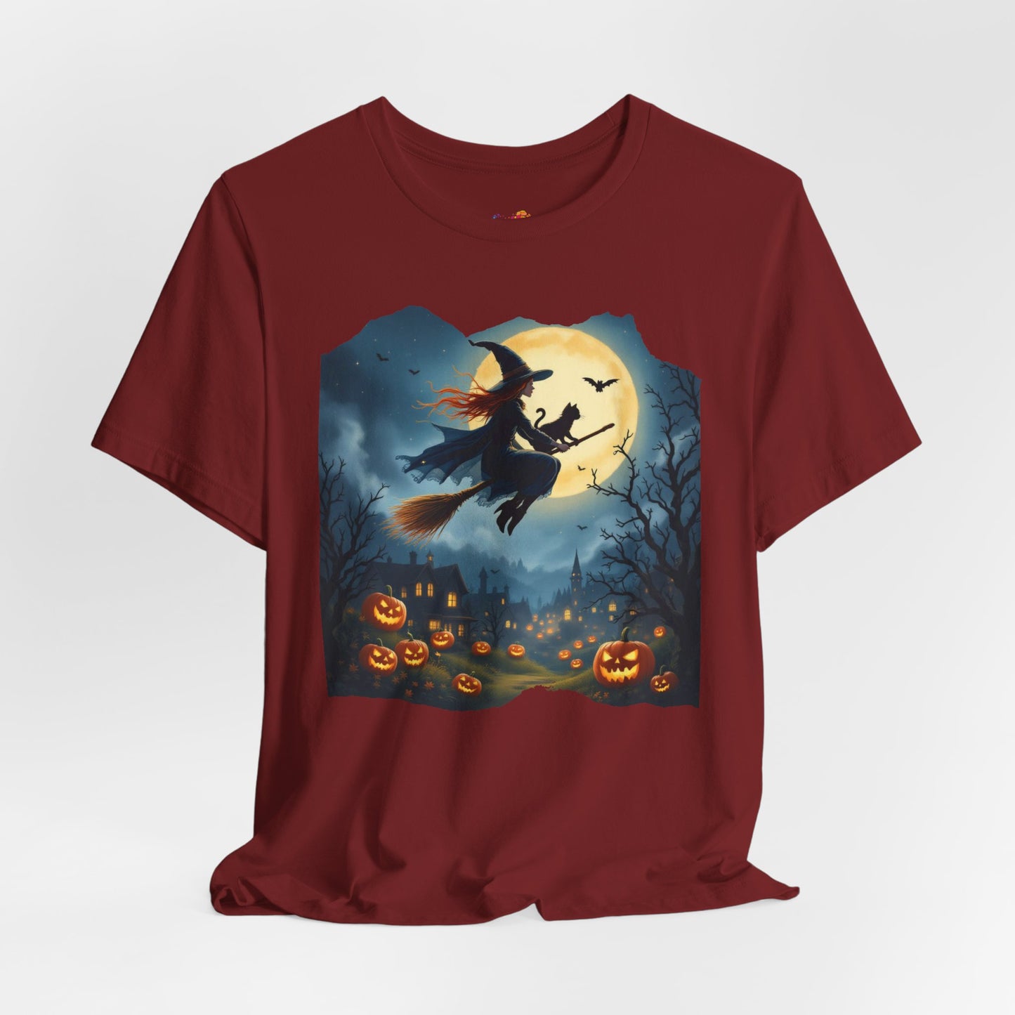 Midnight Flight Tee Magic in the sky. Pumpkins below. Cozy spells in every thread.