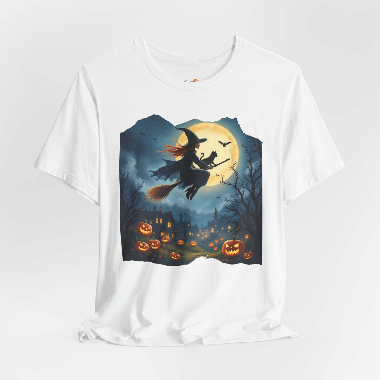 Midnight Flight Tee Magic in the sky. Pumpkins below. Cozy spells in every thread.